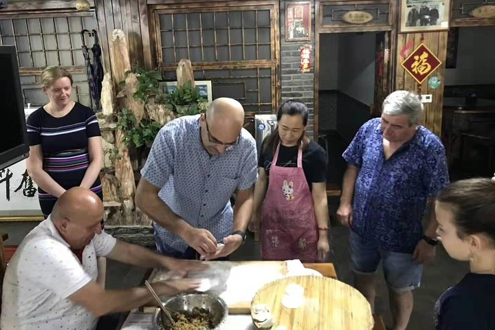 Beijing hutong rickshaw tour with homemade dumplings in family and Lama temple - Photo 1 of 13