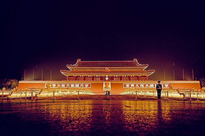 Experience the illuminated grandeur of Tiananmen Square at night with its stunning architecture and historical significance providing a memorable backdrop for your Beijing adventure.