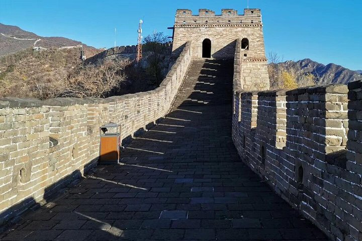 Experience breathtaking views as you ascend the historic Mutianyu Great Wall followed by the fun descent on a toboggan creating unforgettable memories in Beijing's iconic landscape.