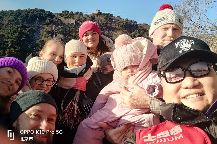 Experience the breathtaking beauty of the Mutianyu Great Wall while connecting with fellow travelers. Enjoy serene mountain views and create lasting memories in a stunning historical setting.