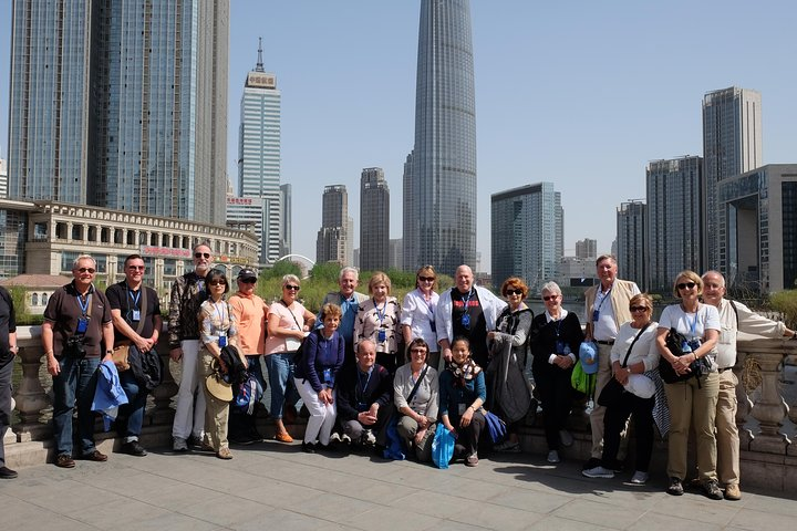 Experience the modern skyline of Tianjin as you explore its iconic landmarks with fellow travelers making unforgettable memories in this historic city rich in culture and innovation.