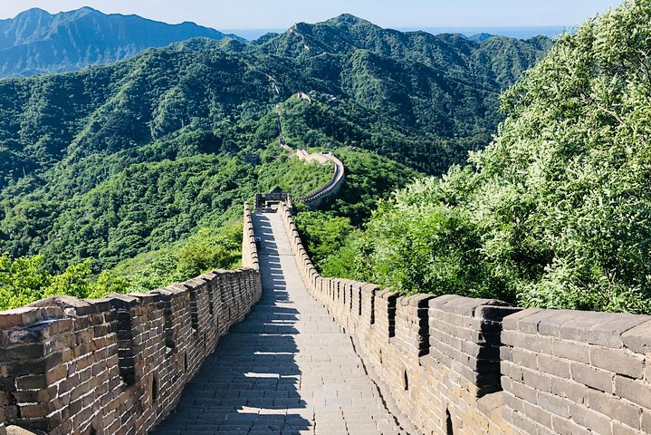 Experience the stunning views of the Mutianyu Great Wall seamlessly accessed with a private driver ensuring a comfortable journey through beautiful landscapes and historic wonders.