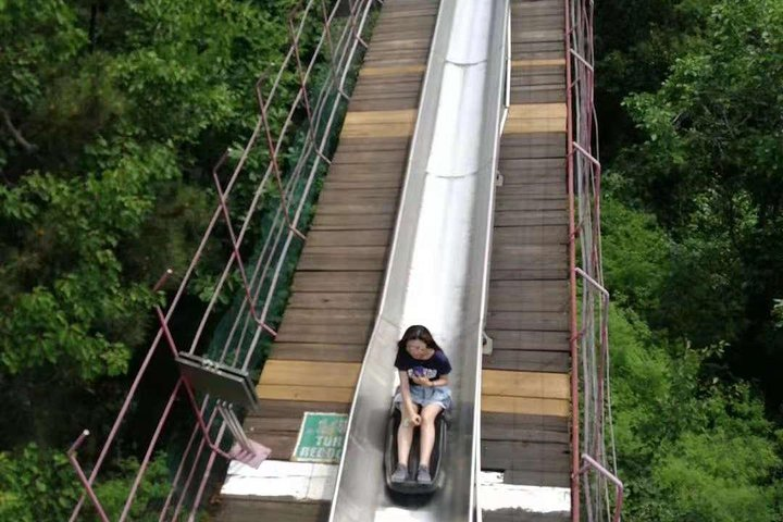 Experience the thrill of a toboggan ride at Mutianyu Great Wall surrounded by stunning mountain scenery blending adventure with the rich history of this iconic landmark.