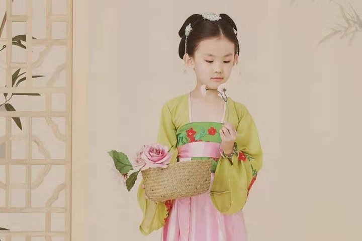 A charming moment combines classic elegance with cultural heritage allowing kids to immerse themselves in the beauty of traditional Chinese dress perfectly capturing the essence of Shanghai's artistic spirit.
