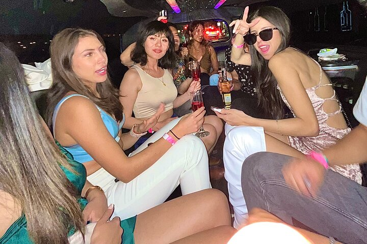 22 people can fit in this limosine there will be all you can drink of barcardi lime or orange in the limousine .