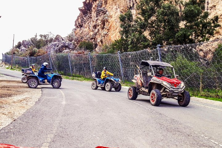 Arrival at the village of Episkopi with a group of buggies and quads. 40m Rock at the background eco site of bird species