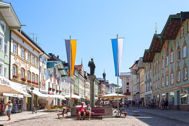 Discover the charm of Bad Tölz as you wander Marktstrasse surrounded by historic Baroque buildings and captivating frescoes. Each step reveals stories waiting to be uncovered.