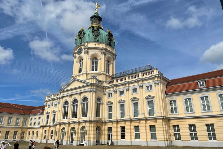 Experience the elegance of Berlin Charlottenburg Palace with stunning architecture and beautifully landscaped gardens offering a glimpse into royal history surrounded by picturesque scenery.