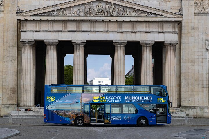Explore Munich's stunning landmarks from the open-top bus enjoying flexible stops and breathtaking views of architectural gems and historical sites at your own pace.