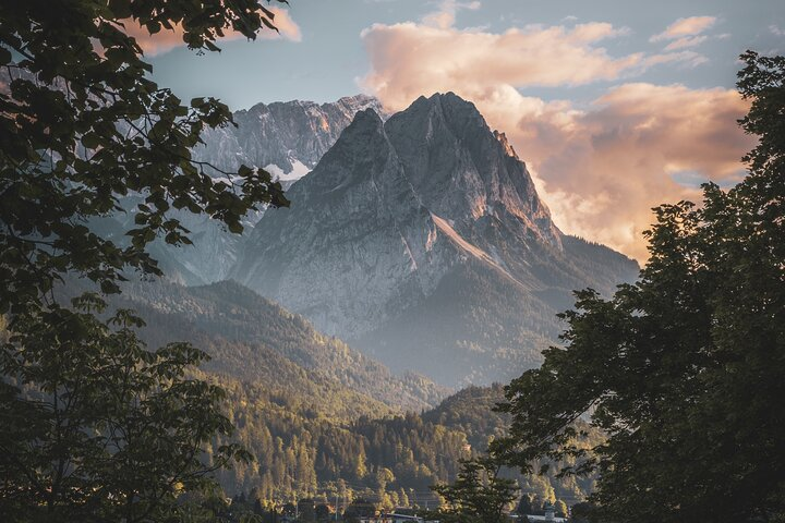 Experience stunning views atop Zugspitze Germany's highest peak. Explore glaciers visit the unique beer garden and wander the charming streets of Garmisch-Partenkirchen for a perfect alpine adventure.