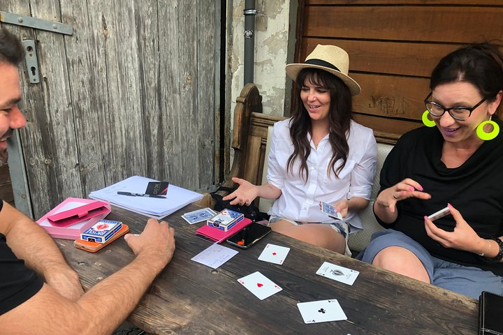 Immerse yourself in the intriguing world of card magic and mindreading with fellow enthusiasts in a cozy Berlin setting where secrets of performance come alive in every interaction.