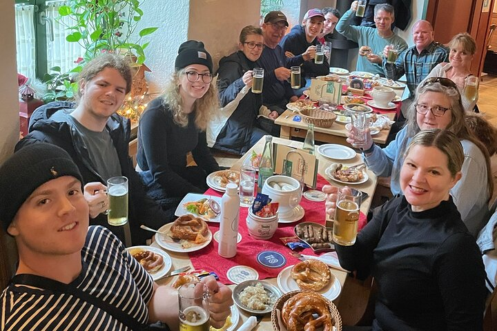 Immerse yourself in the lively dining experience of Viktualienmarkt where diverse flavors and hearty portions unite locals and travelers over delicious traditional dishes and refreshing drinks.