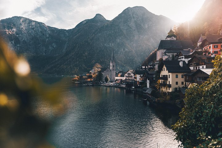 Explore the serene beauty of Hallstatt’s lakeside village framed by majestic mountains. Experience quaint architecture and stunning views along your journey through the Austrian Alps and Salzburg.
