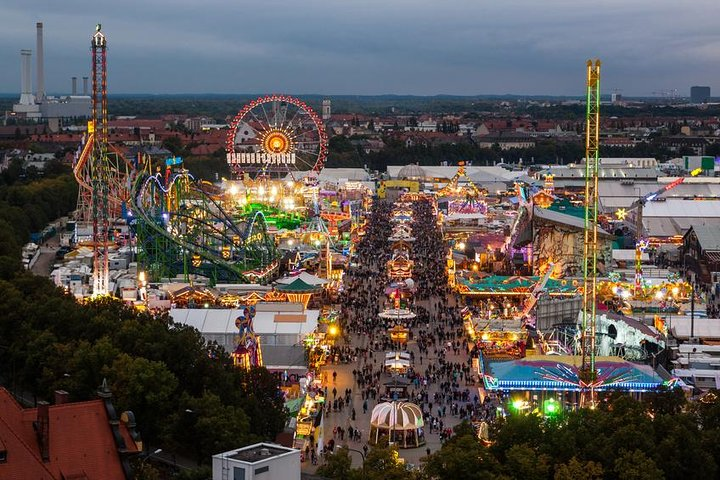 Experience Munich's rich history and spirited celebrations while enjoying guaranteed seating at the iconic Oktoberfest beer tents surrounded by lively festivities and stunning fairground lights.
