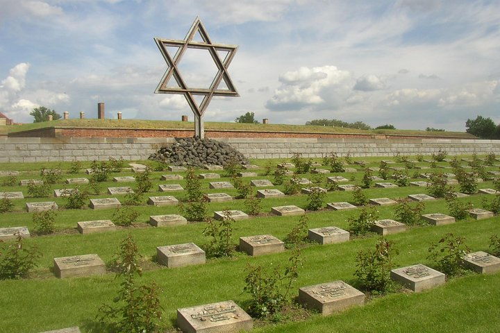 Explore the poignant memorial in Terezin where history unfolds through serene landscapes and significant sites offering reflection on the past during your journey from Berlin to Prague.