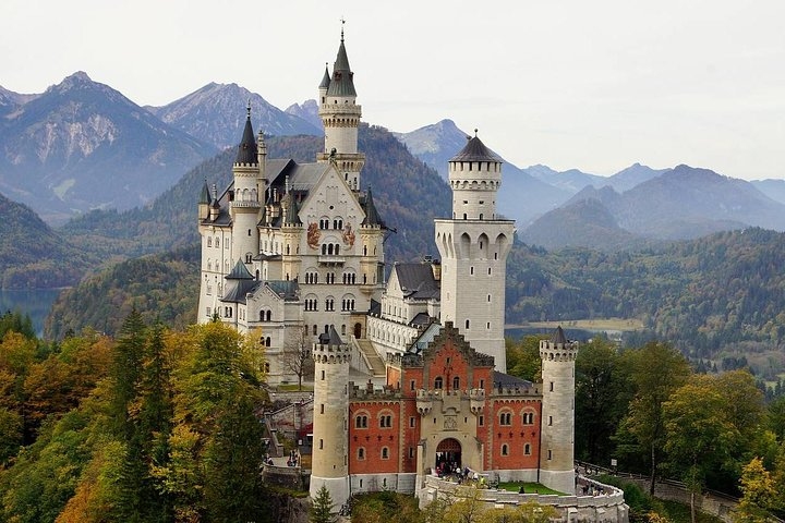 Experience the majestic Neuschwanstein Castle nestled among stunning mountains. Enjoy an audio-guided tour of this architectural wonder and skip the long lines for a seamless journey.