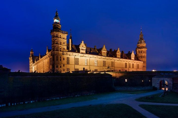 Discover the grandeur of Kronborg Castle as it stands illuminated against the evening sky offering a perfect backdrop for a private exploration of history and culture.