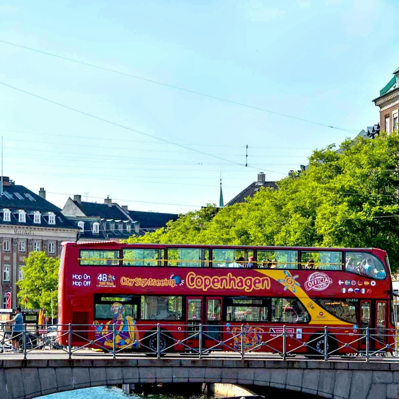 Hop on the red double-decker and explore Copenhagen's famous landmarks charming neighborhoods and green spaces all while enjoying informative audio guides in multiple languages. Perfect for any traveler!
