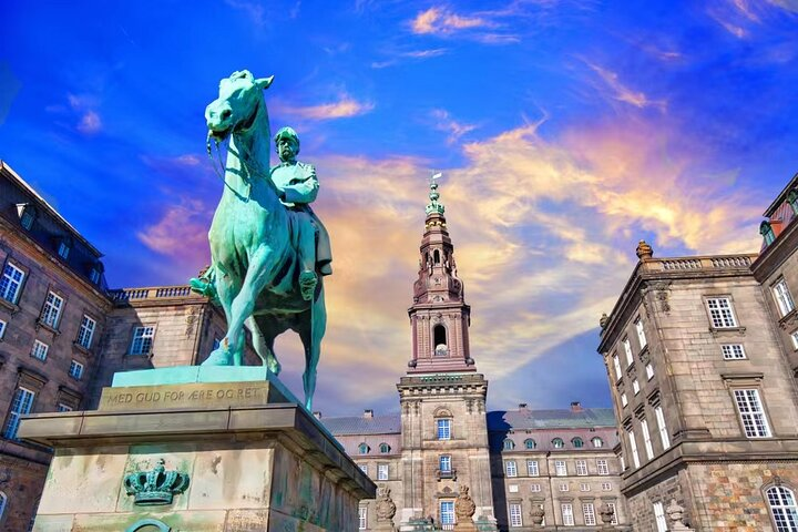 Explore Copenhagen's royal legacy where majestic castles whisper tales of history showcasing Denmark's architectural grandeur against a stunning sky. Immerse yourself in royal stories during this walking tour.