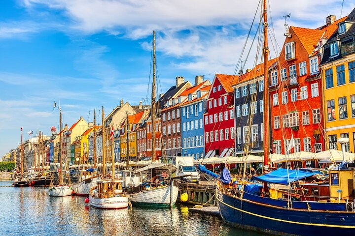 Explore the colorful façades of Nyhavn where charming boats line the canal offering a taste of Copenhagen's rich heritage and maritime culture perfect for travelers seeking adventure and beauty.
