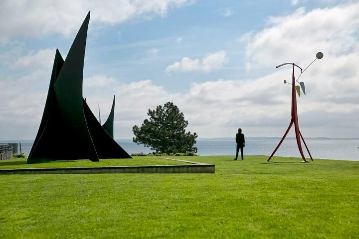 Experience the unique blend of modern art stunning landscapes and fresh air at the Louisiana Museum where sculptures interact harmoniously with nature and create an inspiring journey.