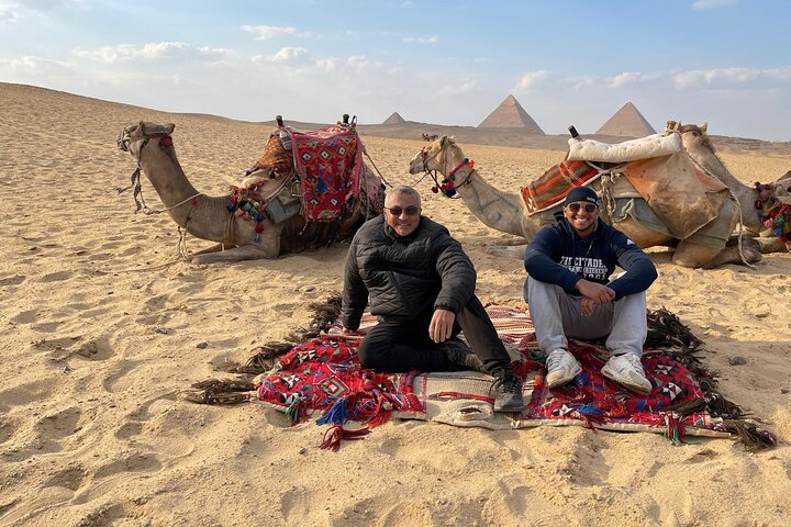 Highlight the iconic pyramids, one of the Seven Wonders of the Ancient World.