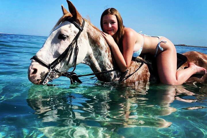 Riding a Horse on the Beach  