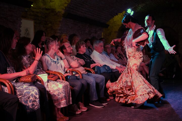 Experience the magic of flamenco in a historic 12th-century vault where soulful singing and passionate dance create an unforgettable evening connecting performers and audience in a unique setting.