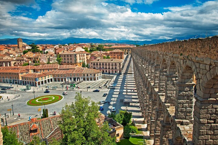 Explore the stunning aqueduct of Segovia a testament to ancient engineering surrounded by charming streets and rich culinary delights perfect for immersing yourself in Spain's rich history.