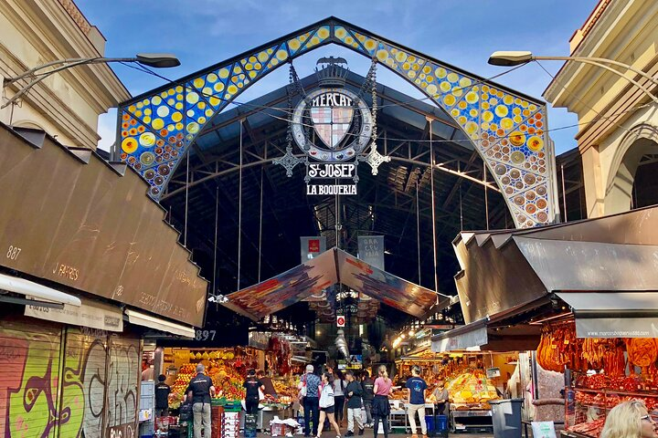 Immerse yourself in the lively charm of La Boqueria where the inviting scents of fresh produce and spices beckon blending history with the essence of local culture in every step.