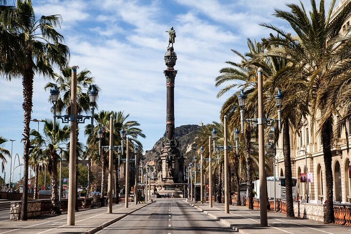 Explore stunning waterfront views lush palm-lined promenades and the iconic Columbus Monument immersing yourself in Barcelona's rich maritime heritage and lively cultural scene. A memorable journey awaits!