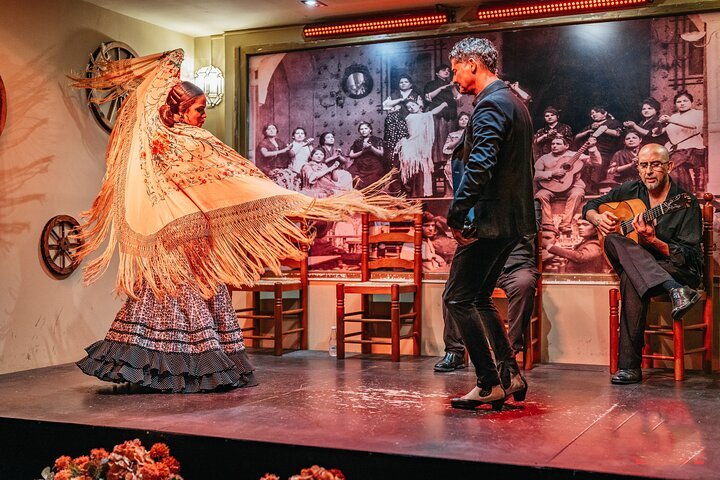 A couple dancing flamenco while playing castanets