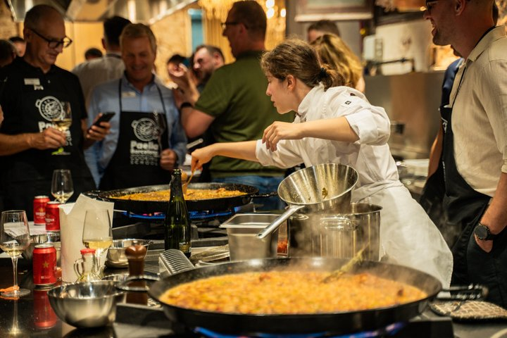 Masterclass in action! ‍ Chef Maria skillfully manages two large 60cm paellas simultaneously while teaching our participants—showing the true scale of our hands-on cooking experience.