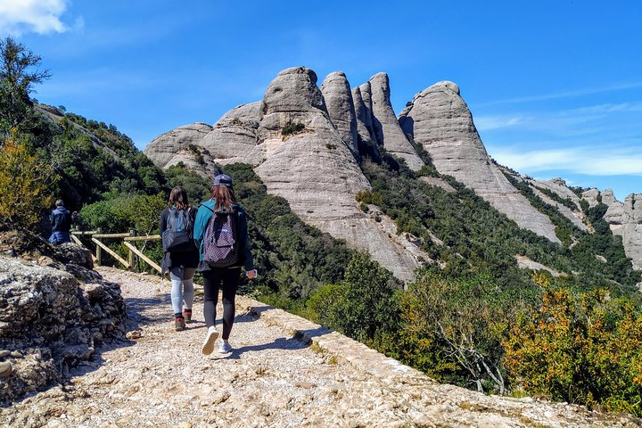 Discover the breathtaking trails of Montserrat where local guides lead you through stunning landscapes and fascinating history offering an intimate experience in a small group.