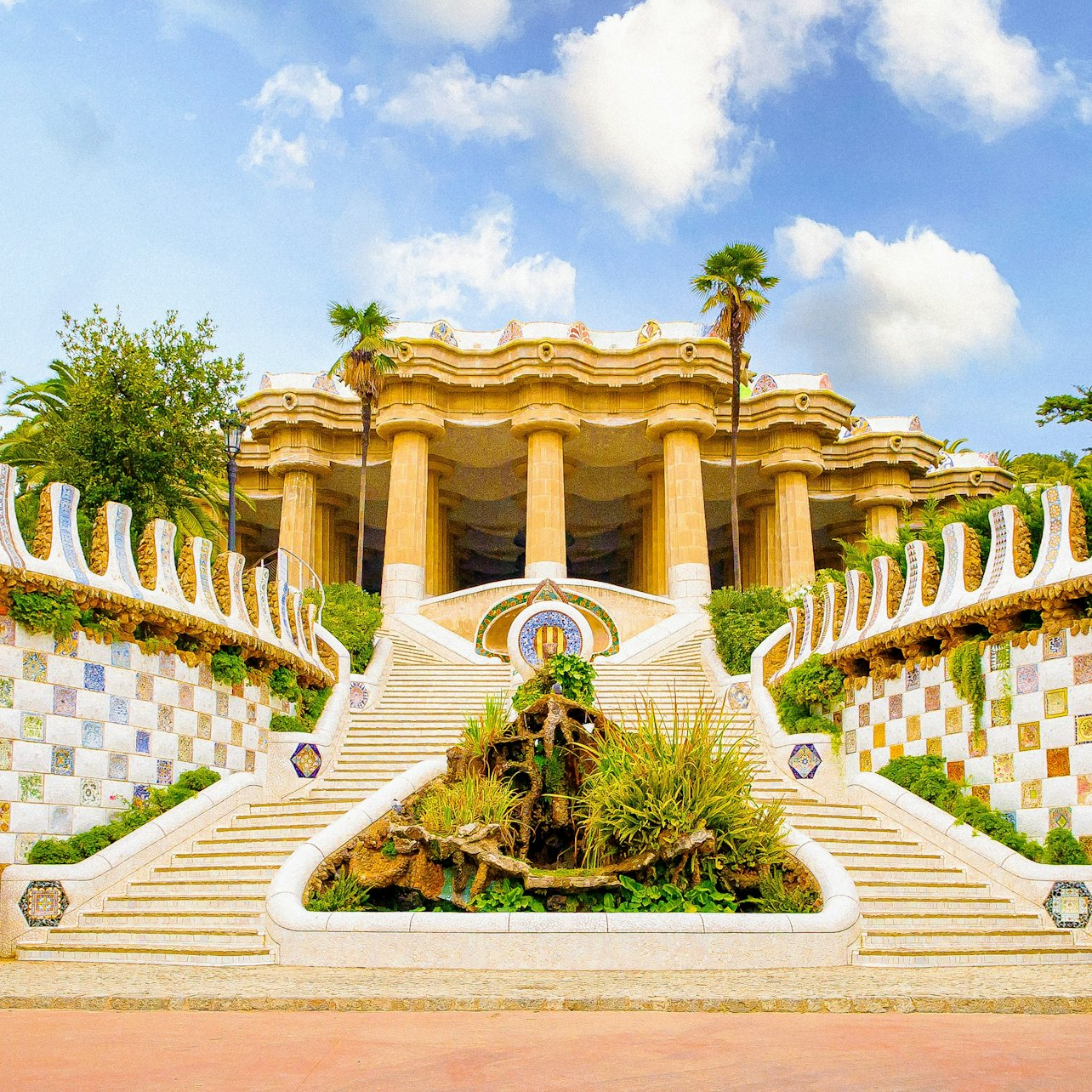 Experience the lush gardens and mosaic pathways of Park Güell while discovering Gaudí's unique architectural styles and enjoying stunning views of Barcelona from iconic spots.