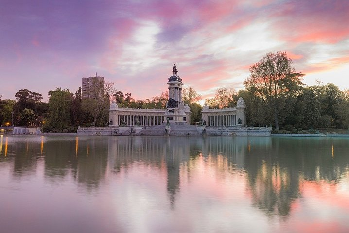 Explore the serene beauty of Retiro Park with its stunning reflections and historical landmarks offering a peaceful retreat amid the vibrant life of Madrid. A perfect blend of nature and culture.