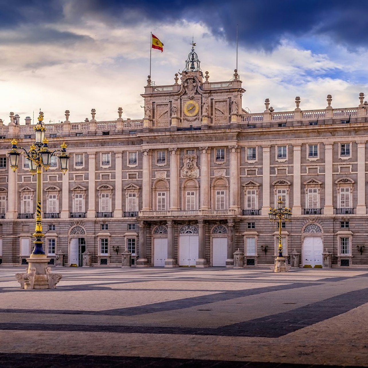 Step into history at Madrid's Royal Palace where stunning architecture and lush gardens await. Discover royal tales and exquisite art as you explore this regal landmark.