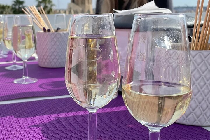 Savor authentic Sherry wines while indulging in marinated olives aged Manchego and Iberian sausage all against the stunning backdrop of Sevilla and Triana from a rooftop setting.