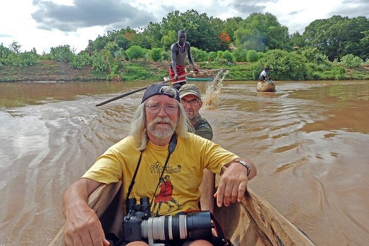 Crossing the Omo river by a local made boat to visit the Dacenech tribe and the Omo delta. 