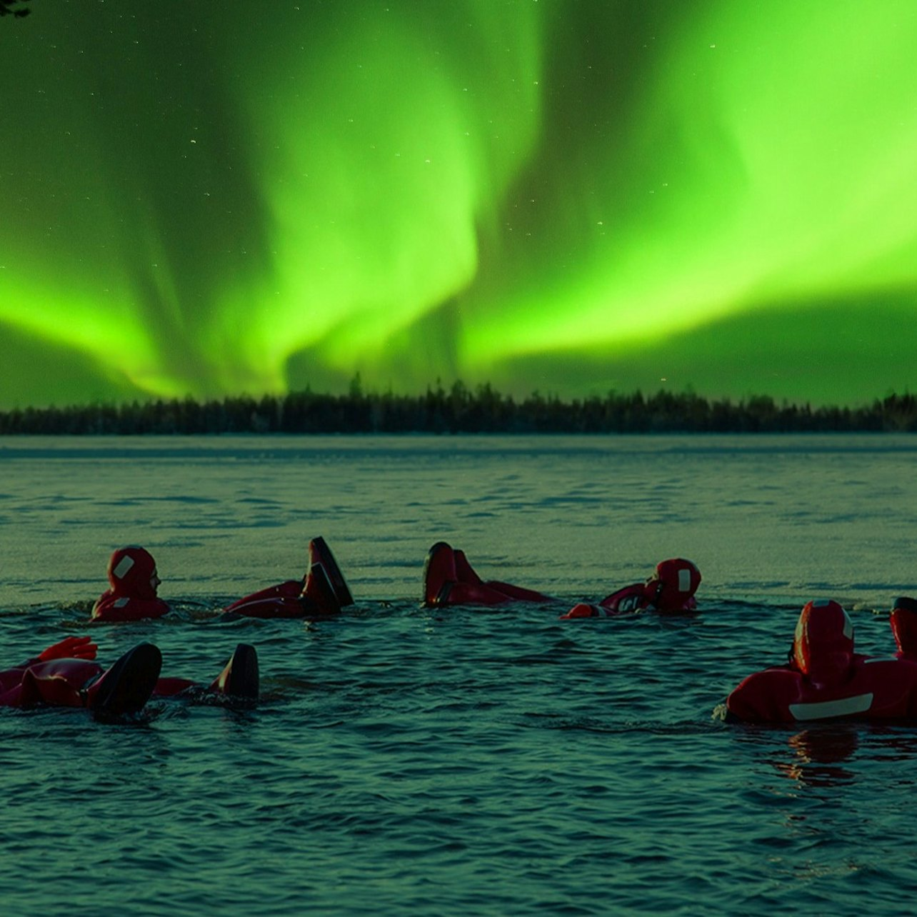 Drift under the mesmerizing northern lights in a snug floating suit on a Finnish lake sipping hot drinks and enjoying gingerbread while nature puts on a show.