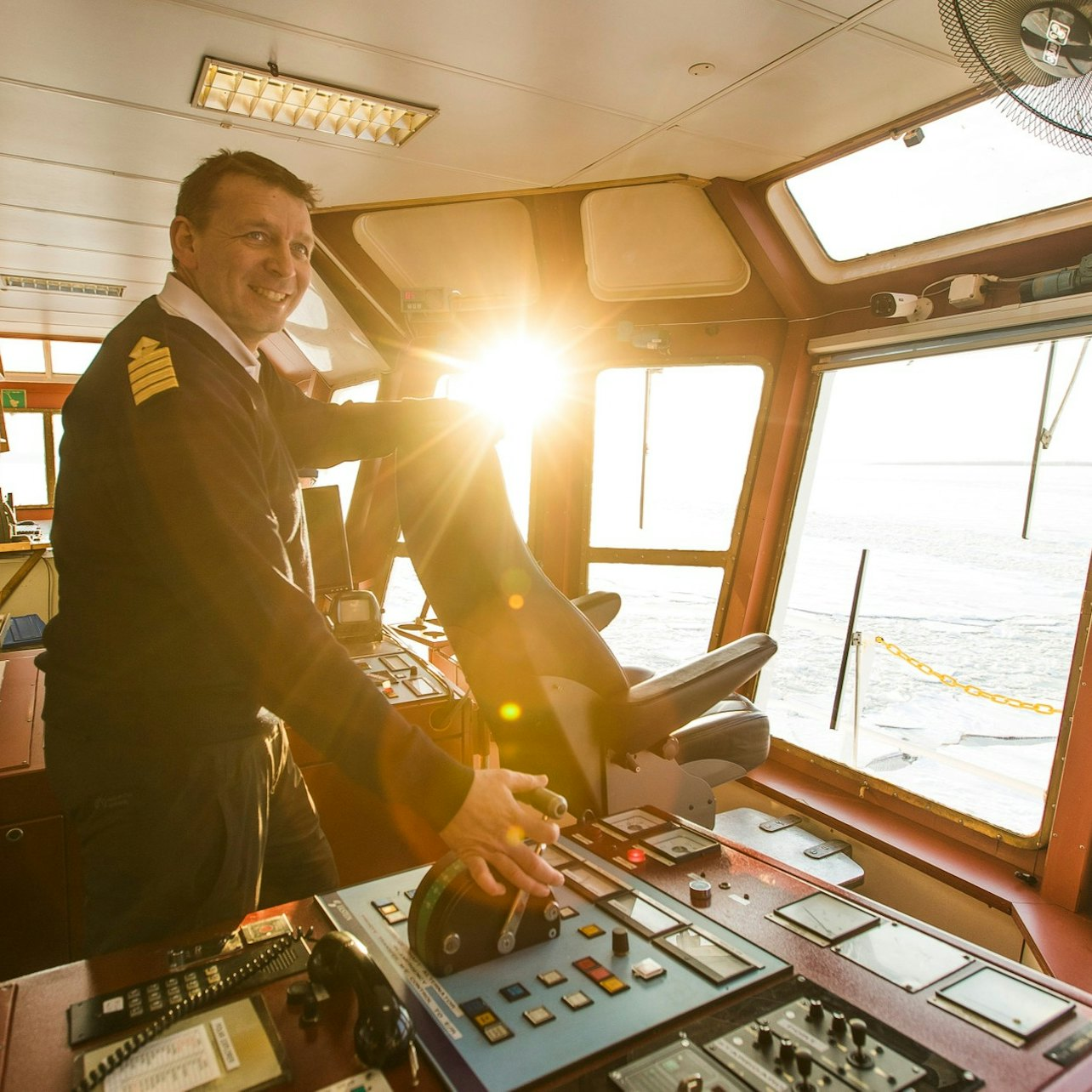 Experience the true essence of Lapland as you navigate icy waters and enjoy breathtaking views from the ship's helm guided by an expert captain on this unique winter journey.