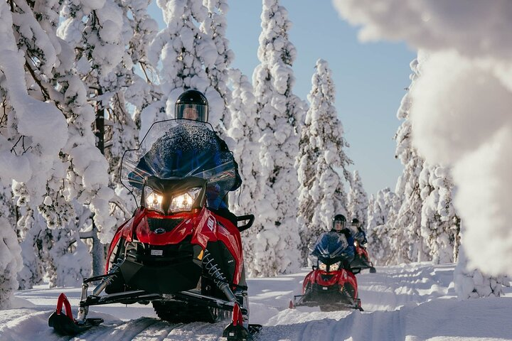Experience the rush of snowmobiling through pristine snow-covered forests leaving a trail of excitement behind. Enjoy the freedom of the open trail in the serene beauty of Rovaniemi.