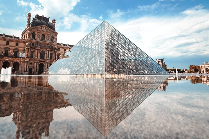 Experience the grandeur of the Louvre's iconic glass pyramid where art and history intertwine inviting explorers to uncover timeless masterpieces in an unforgettable setting.