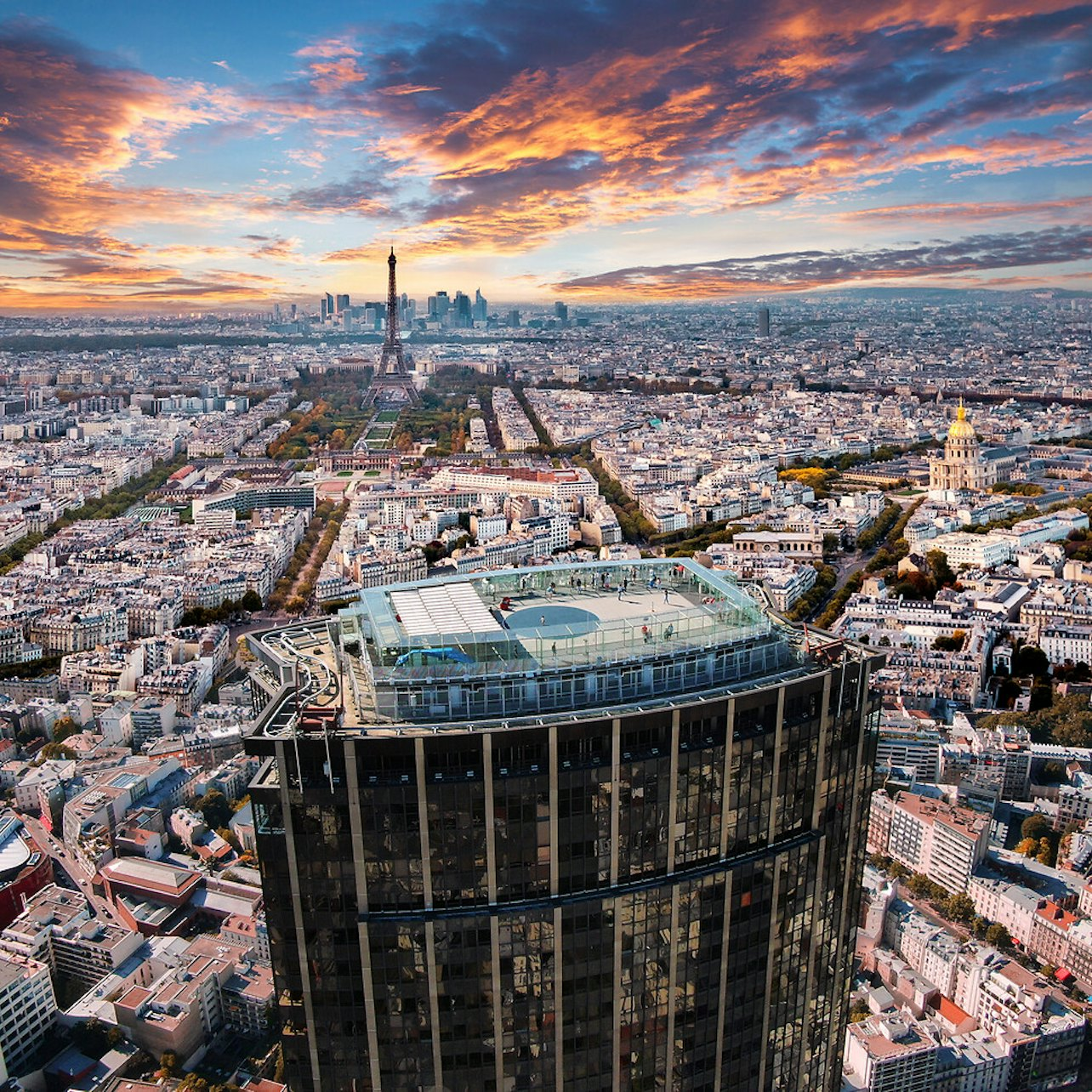 Gaze upon Paris from the Montparnasse Tower's 56th floor where stunning views reveal iconic landmarks and the city's charm unfolds beneath a breathtaking sky during sunset.