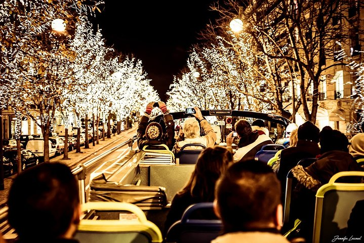 Experience the magic of Paris illuminated at night as you stroll past iconic landmarks and twinkling lights creating unforgettable holiday memories with your loved ones.
