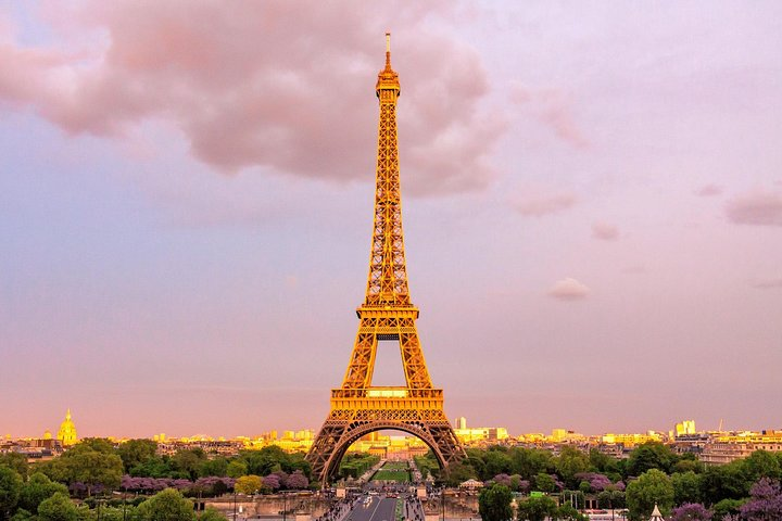 Experience breathtaking views of Paris from the Eiffel Tower's second floor with guided access and a unique glass floor for an unforgettable descent. Perfect for travelers seeking iconic moments.