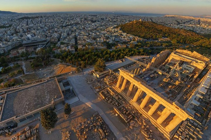 Explore the Acropolis and Parthenon on a guided walking tour revealing the stunning beauty of Athens' ancient landmarks against the backdrop of modern city life. Discover history like never before.