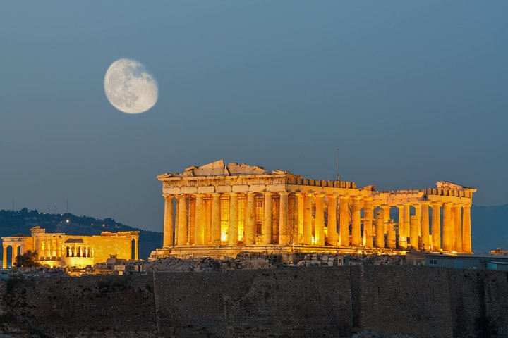 Explore the timeless beauty of the Parthenon under a glowing moon where ancient history meets modernity offering a unique journey through Athens' captivating heritage and iconic landmarks.
