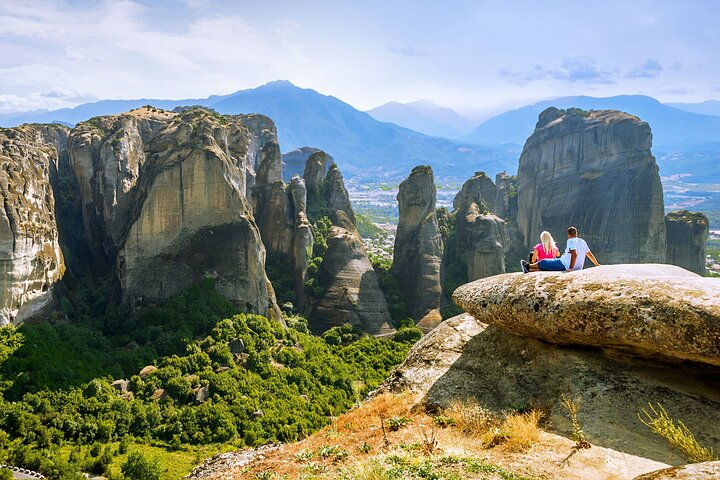 Experience breathtaking views while exploring ancient monasteries perched atop towering cliffs immersing yourself in Greece's rich history on this unforgettable Meteora adventure.
