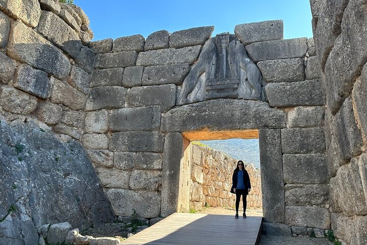 Step through the imposing Mycenae Lions Gate where ancient history whispers tales of Agamemnon. Experience a connection to Greece’s rich past surrounded by timeless stone walls.